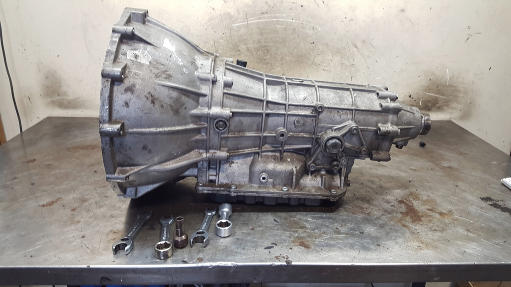 Automotive transmission assembly on a service workbench